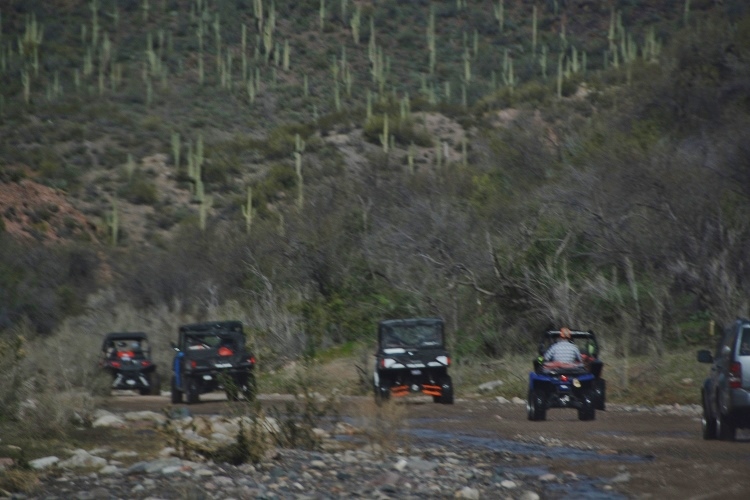 off-road vehicles on river wash
